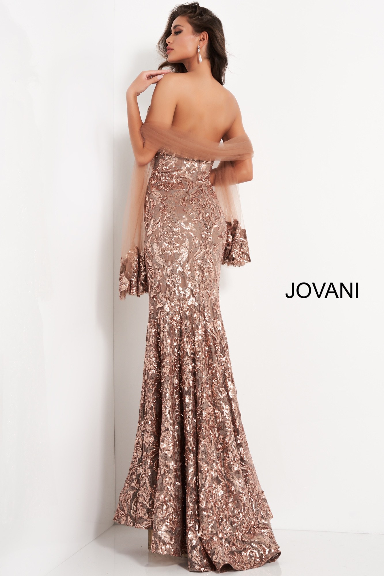 Back view of model in Jovani 05054 mermaid gown with elegant sequin embellishments.