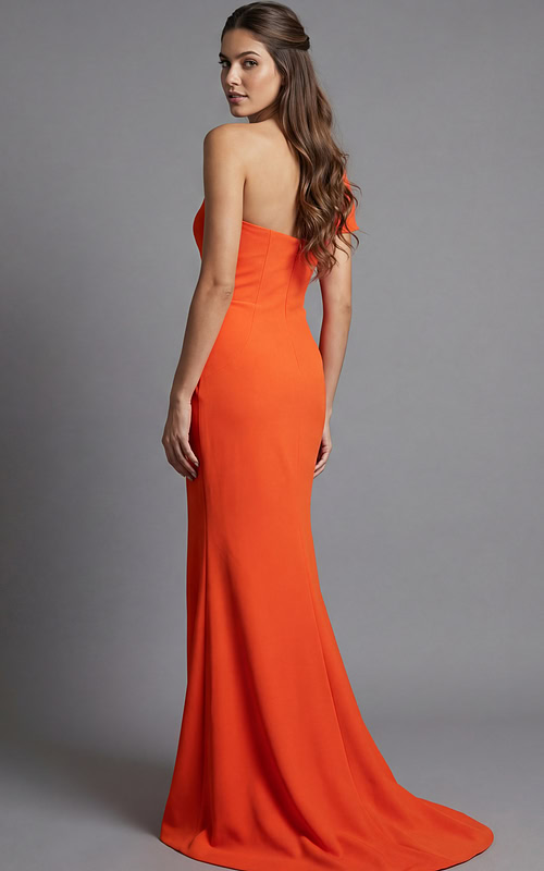 Side view of fitted one shoulder gown with smooth back and flowing hem