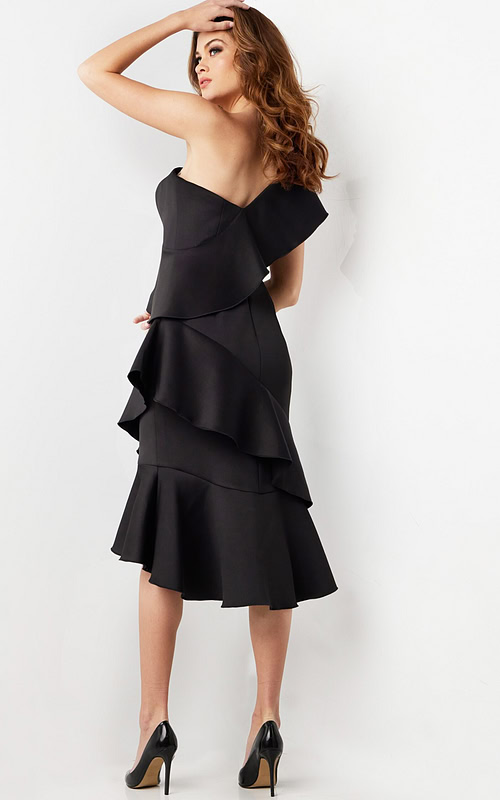Back view of model in Jovani 25971 black dress highlighting one-shoulder design.
