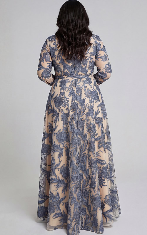 Back view of embroidered A-line gown with belt and sheer overlay