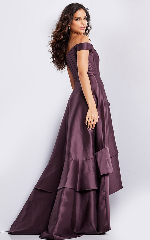 Back view of model in Jovani 37014 brown dress, showcasing the flowing layered skirt.
