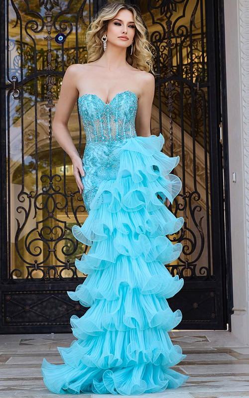Model wearing Jovani 38295 blue gown with sweetheart neckline and ruffled skirt.