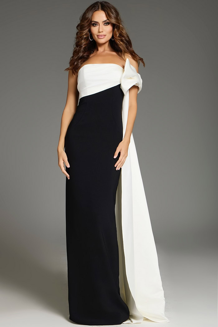 Model wearing Jovani 38864 floor-length black and white gown with off-the-shoulder neckline