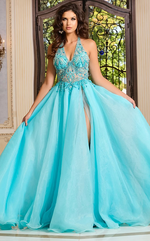 Model wearing Jovani 39642, an embellished blue halter neckline gown with a high slit.