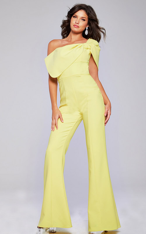Model wearing Jovani 39961 yellow one-shoulder jumpsuit with wide-leg pants, front view.