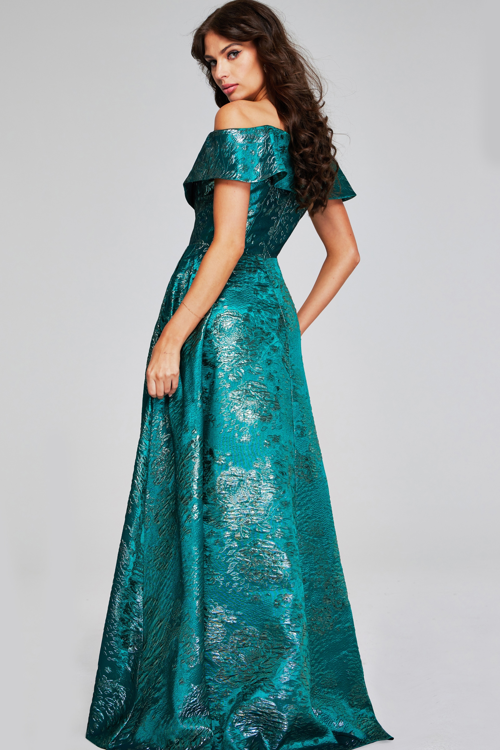 Model wearing Jovani 40296 green dress, off-the-shoulder, back view.