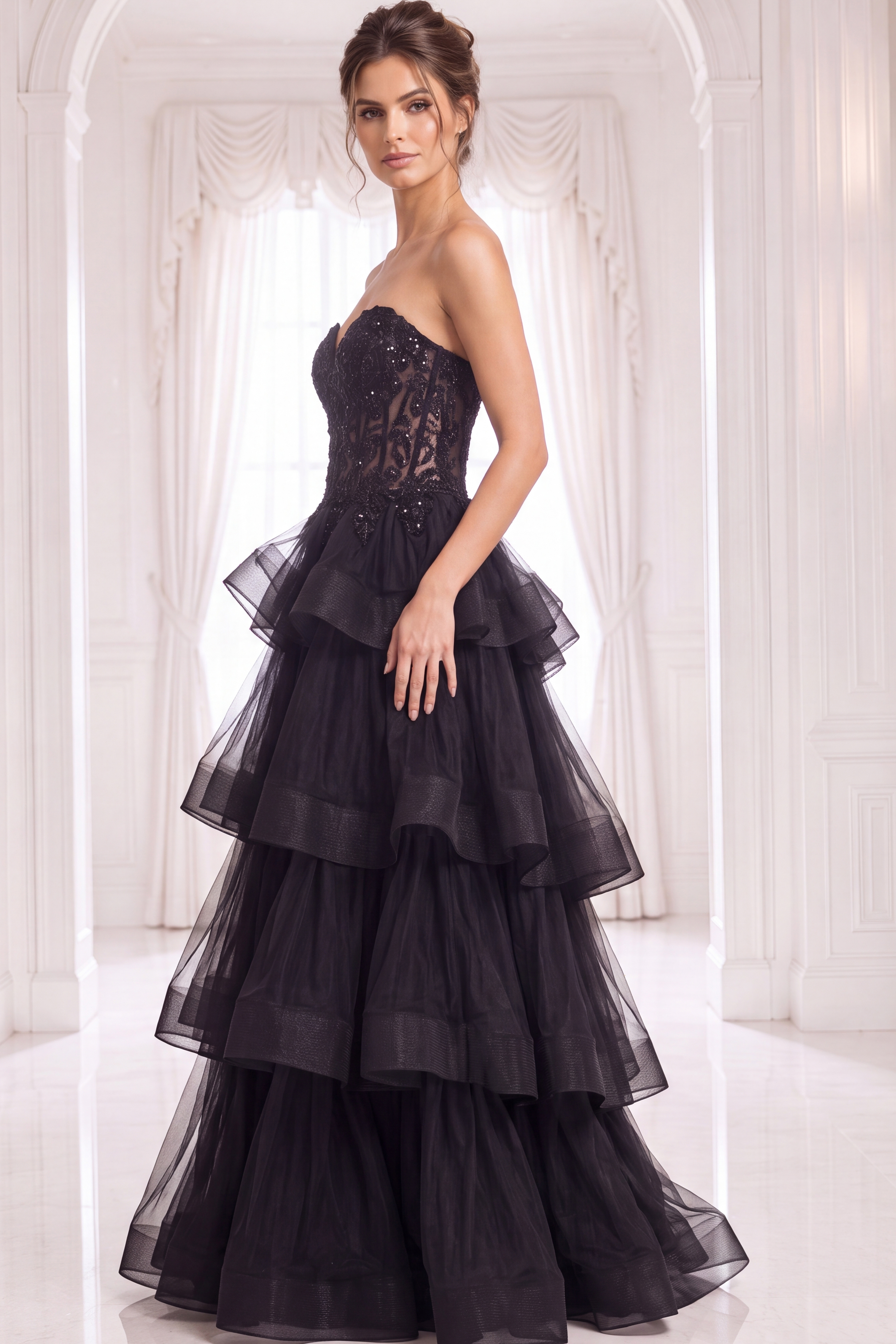 Black strapless ball gown with lace embellished bodice and layered tiered tulle skirt