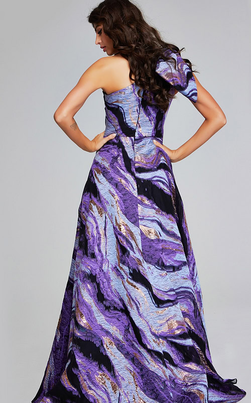 model wearing Jovani 40695 purple gown, back view highlighting flowing skirt