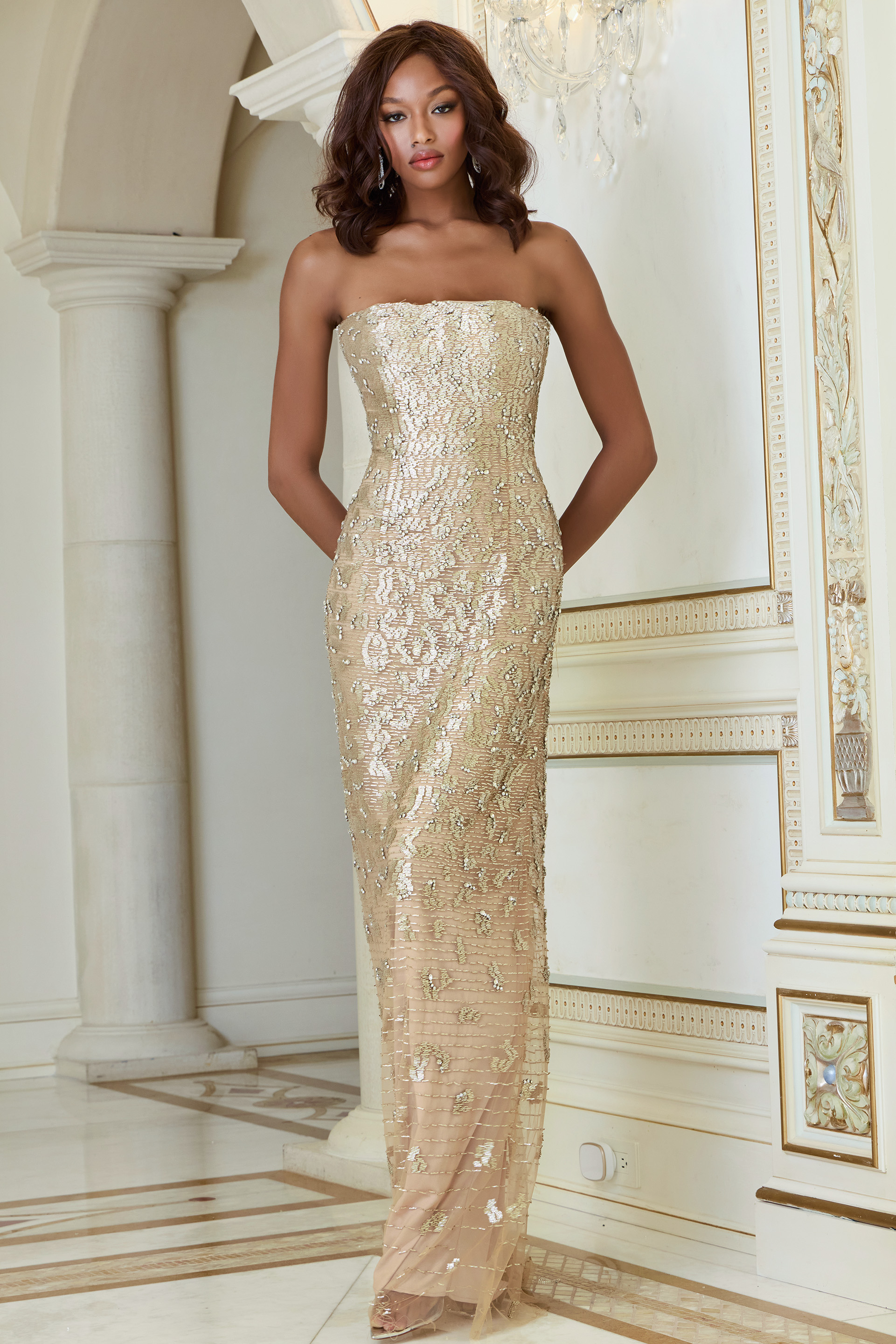Model wearing Jovani 40887 nude strapless full-length gown from the front.