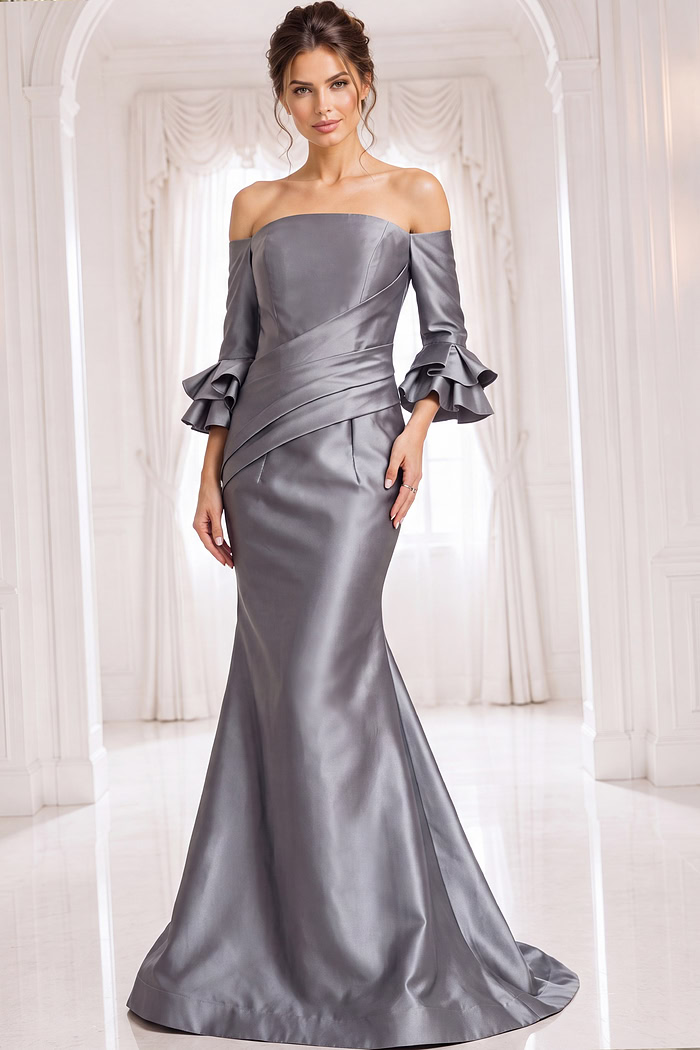 Elegant gray silver evening dress featuring an off the shoulder neckline, three-quarter flared sleeves, ruched bodice, and flowing mermaid skirt with train.
