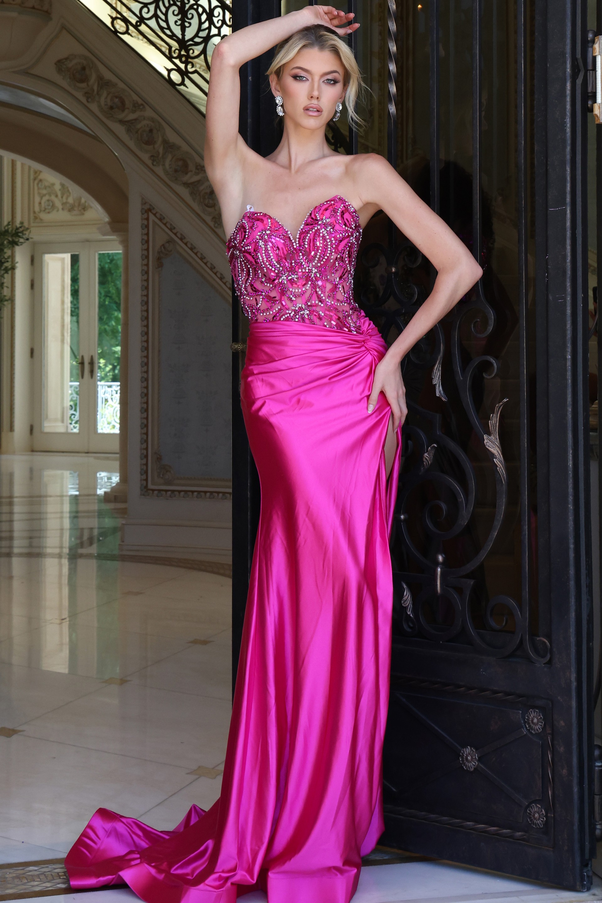 fuchsia beaded corset dress with high slit - front full body, arm raised hand on hip slit