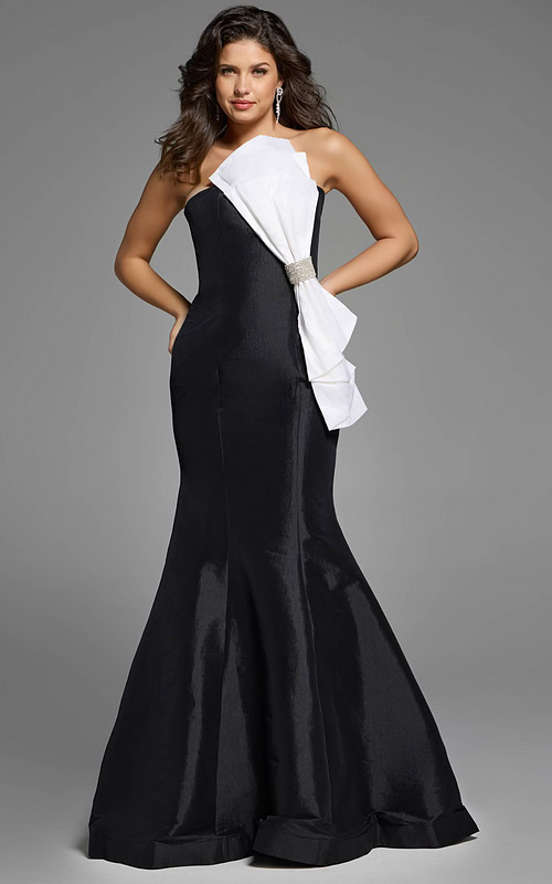 Strapless mermaid gown with asymmetrical white bow and rhinestone detail.