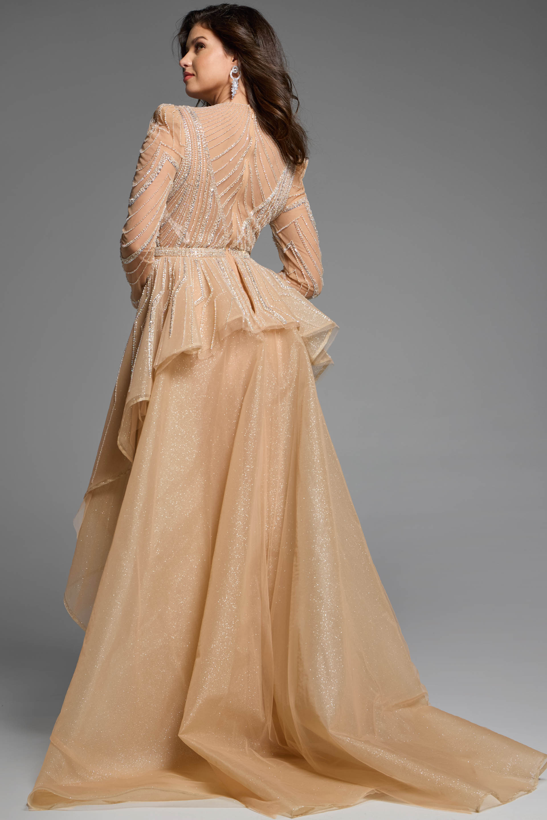 Back view of a beaded gown featuring layered tulle details and a fitted silhouette.