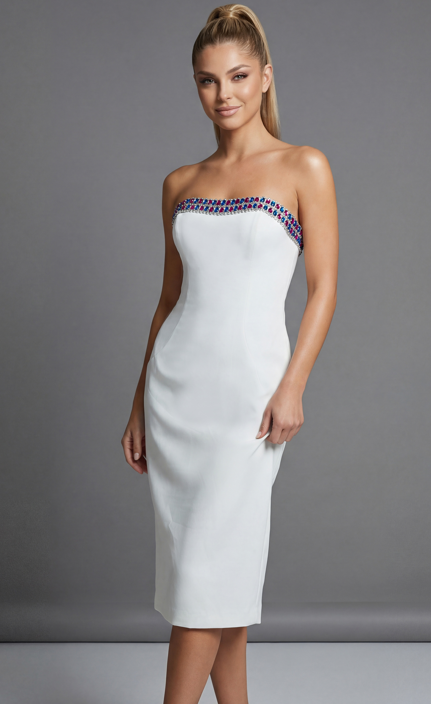 front view of Jovani 44894 white strapless midi dress highlighting the multicolor gemstone embellished neckline with blue, fuchsia, and silver crystal detailing.