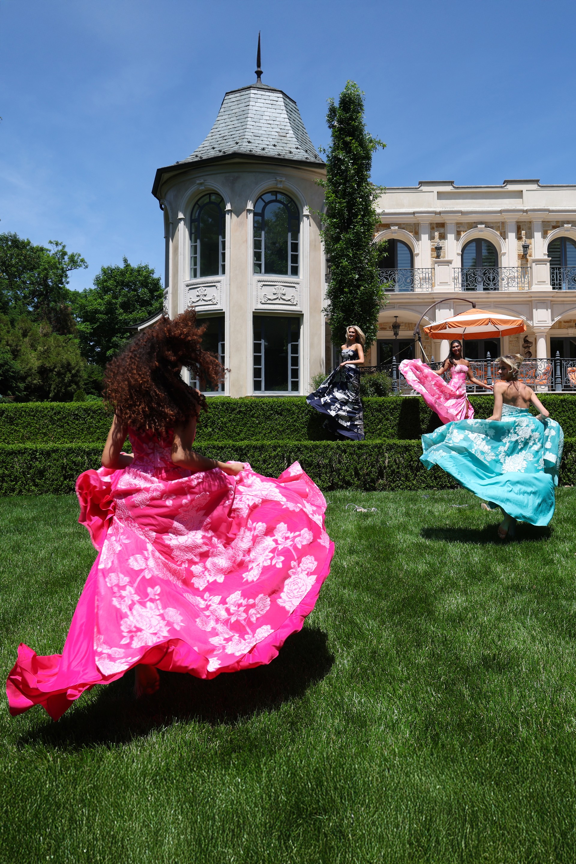 strapless jacquard gown with floral embroidery - group back view, dresses flowing, vibrant, dancing