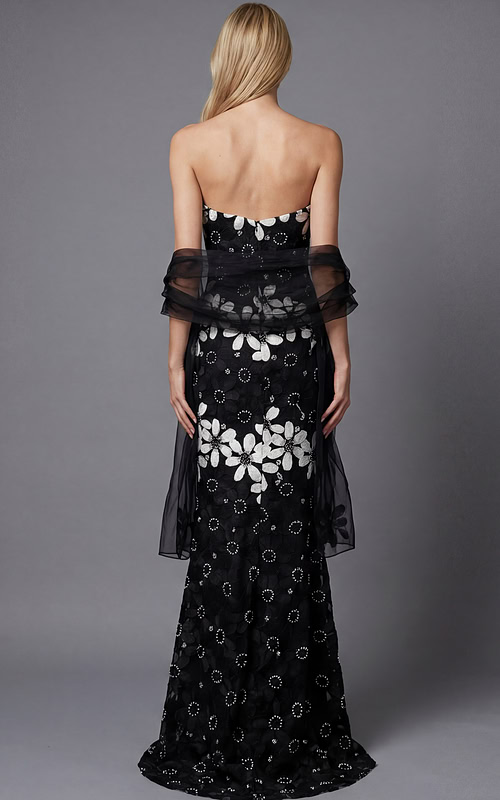 Back view of a strapless floral brocade column gown with fitted silhouette