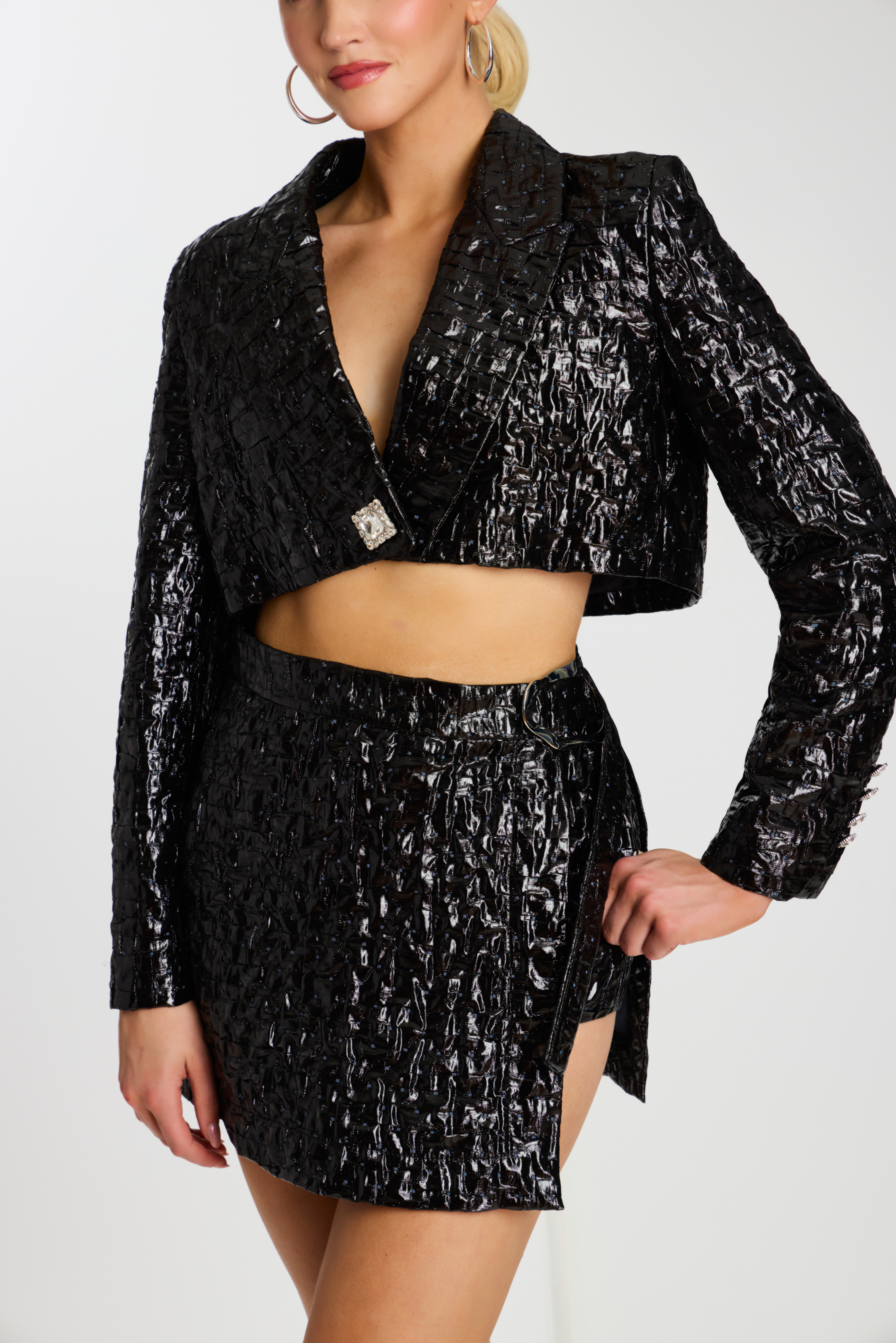 Close-Up of Black Mini Skirt and Crystal Buckle Detail