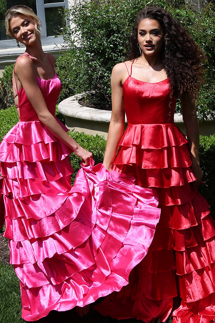 tiered satin dress with spaghetti straps - two girls front, hot pink red dresses holding skirts