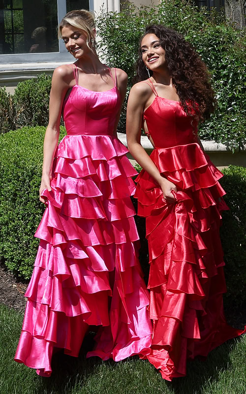 tiered satin dress with spaghetti straps - two girls front, blonde updo curly hair smiling