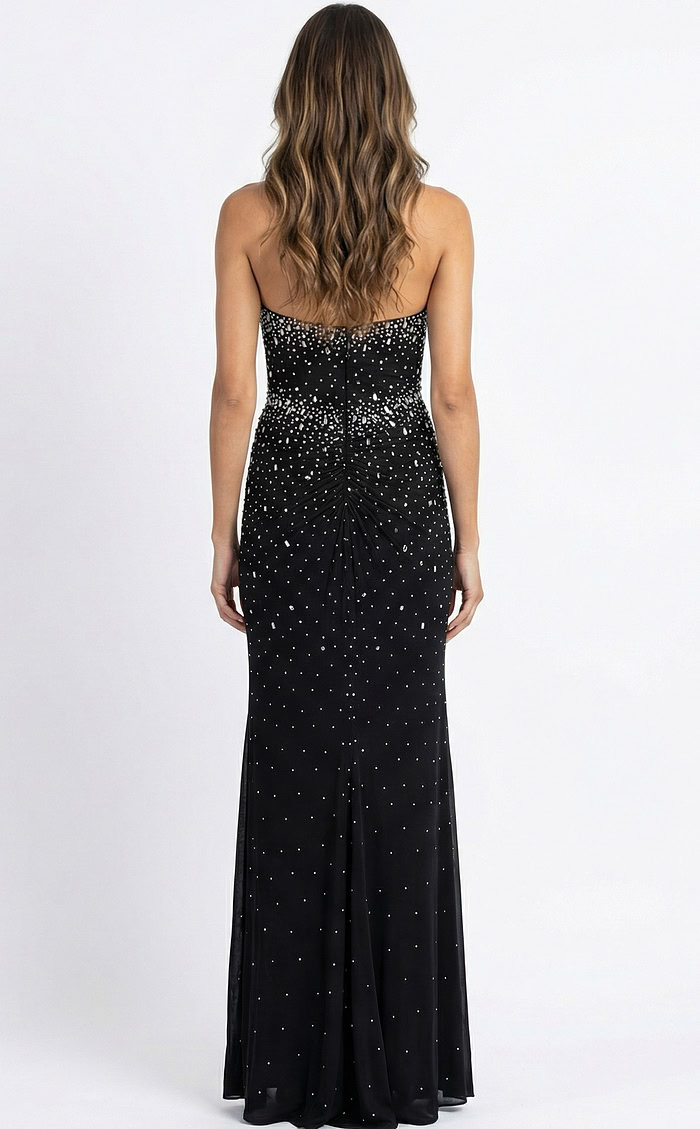 Back view of fitted halter gown with open back, gathered detailing, and floor length silhouette