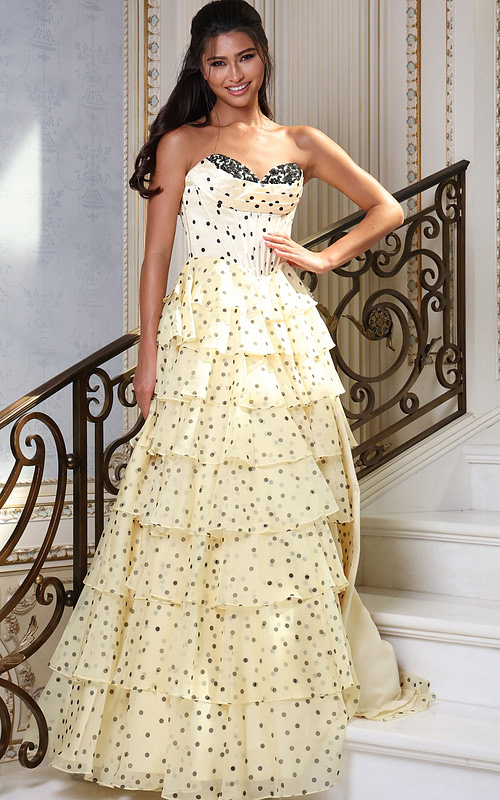 champagne strapless polka dot tiered gown - front full body, smiling hand on hip dark hair on stairs
