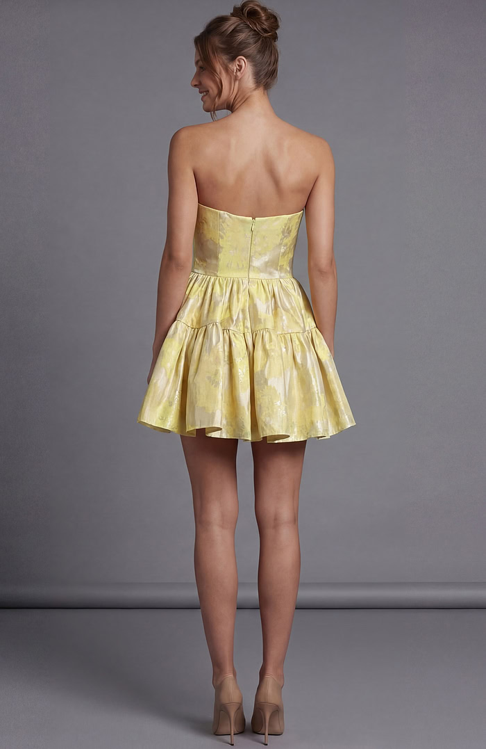 Shimmering yellow floral jacquard dress with a short tiered skirt and a form-fitting strapless top.
