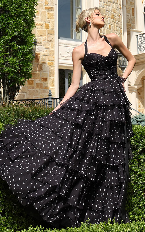 blackwhite halter polka dot tiered dress with bow bodice - front full body, blonde updo, fanned skirt, looking upward