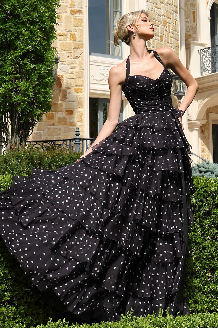 blackwhite halter polka dot tiered dress with bow bodice - front full body, blonde updo, fanned skirt, looking upward