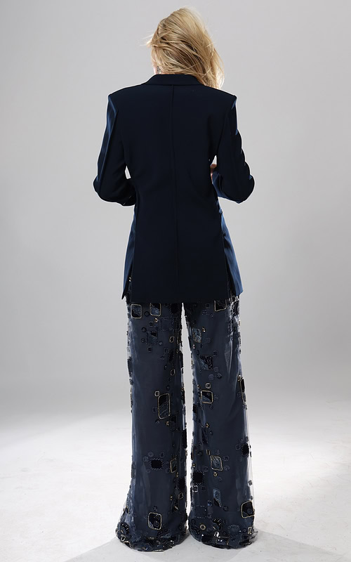 back view of navy beaded blazer jumpsuit with plunging neckline, gold buttons and sheer embellished wide leg pants, Jovani style 52096
