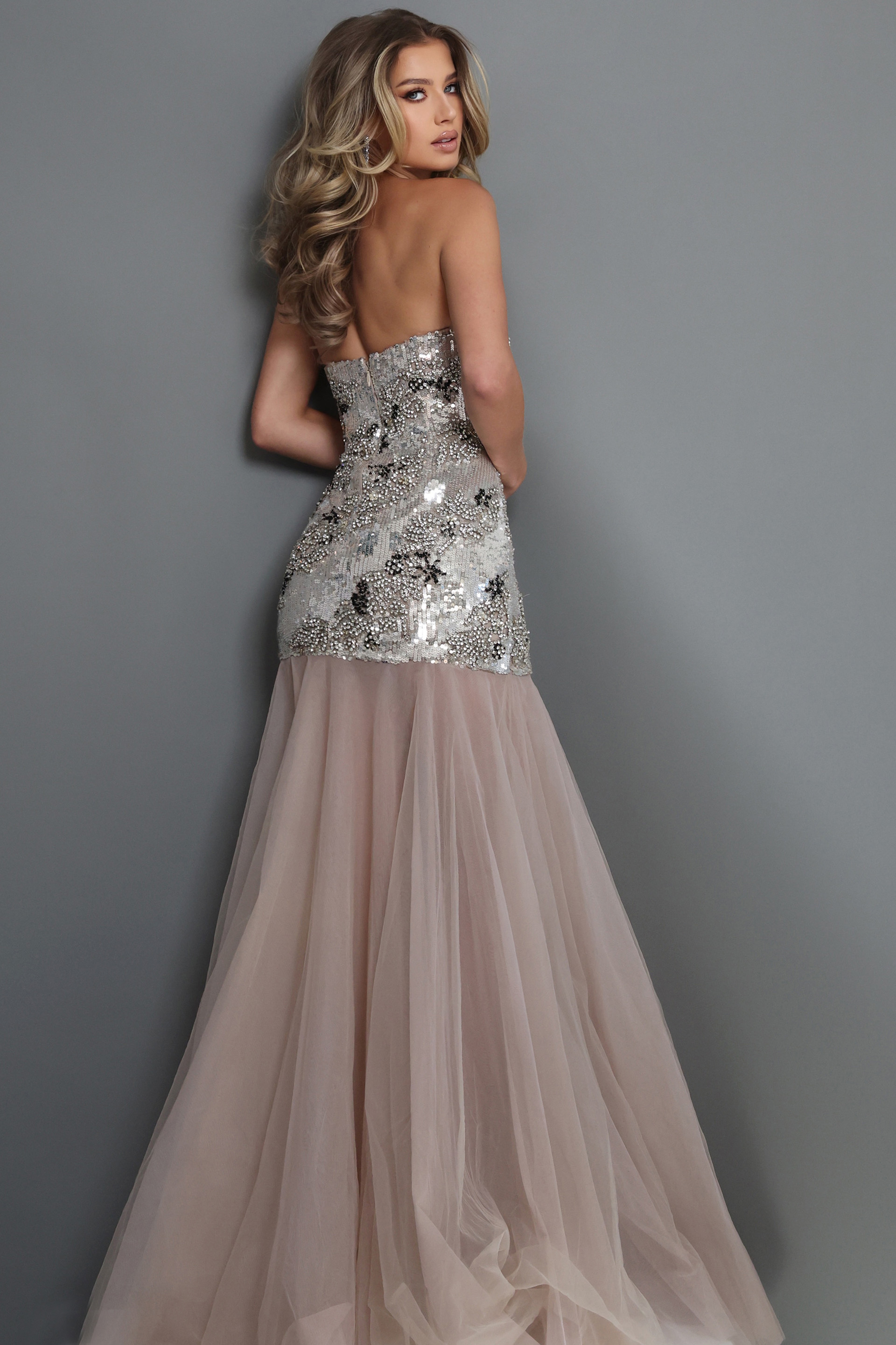 elegant strapless evening gown featuring an intricately beaded fitted silhouette