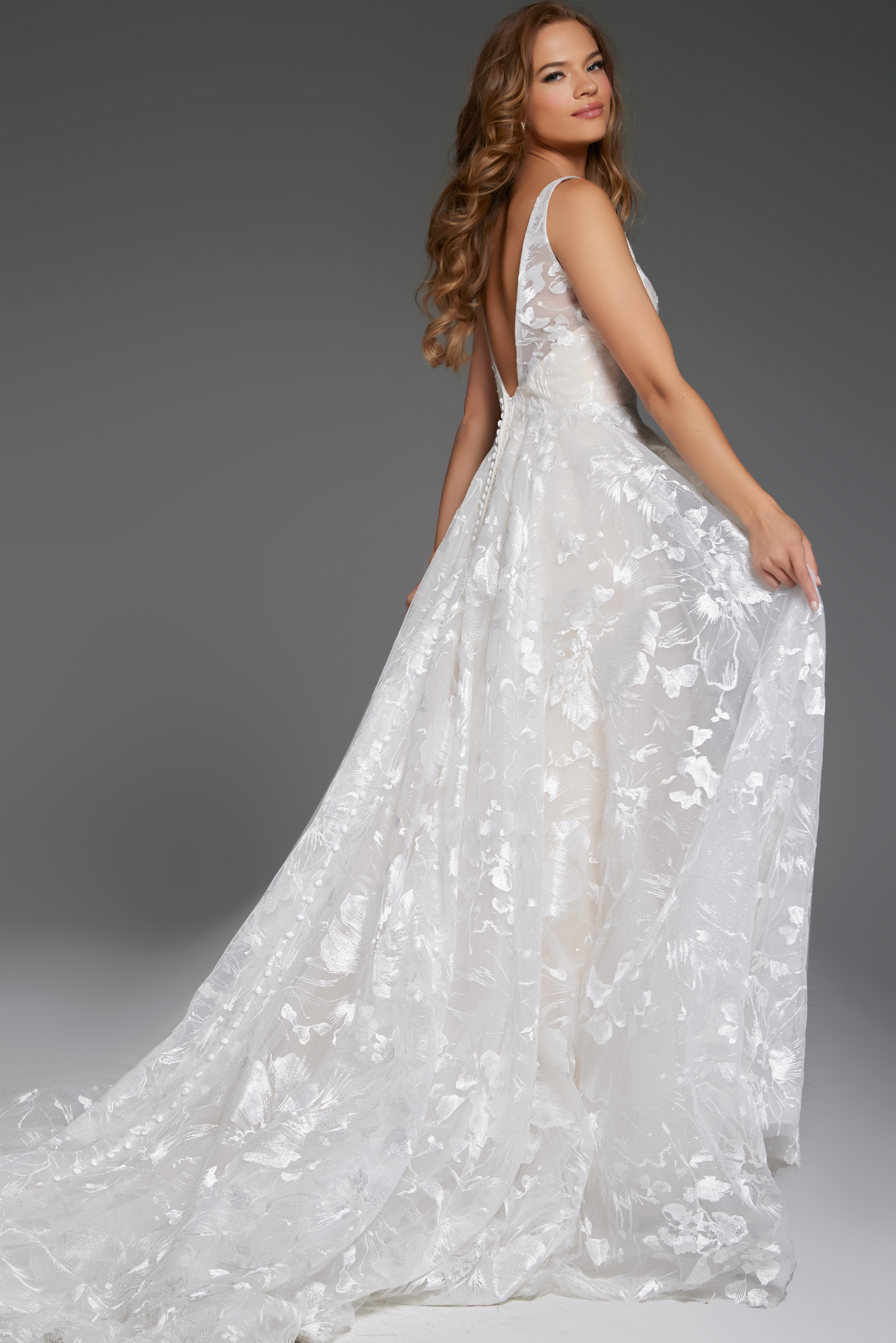 Back view of Jovani JB37434 highlighting its low back cut and lace detail.