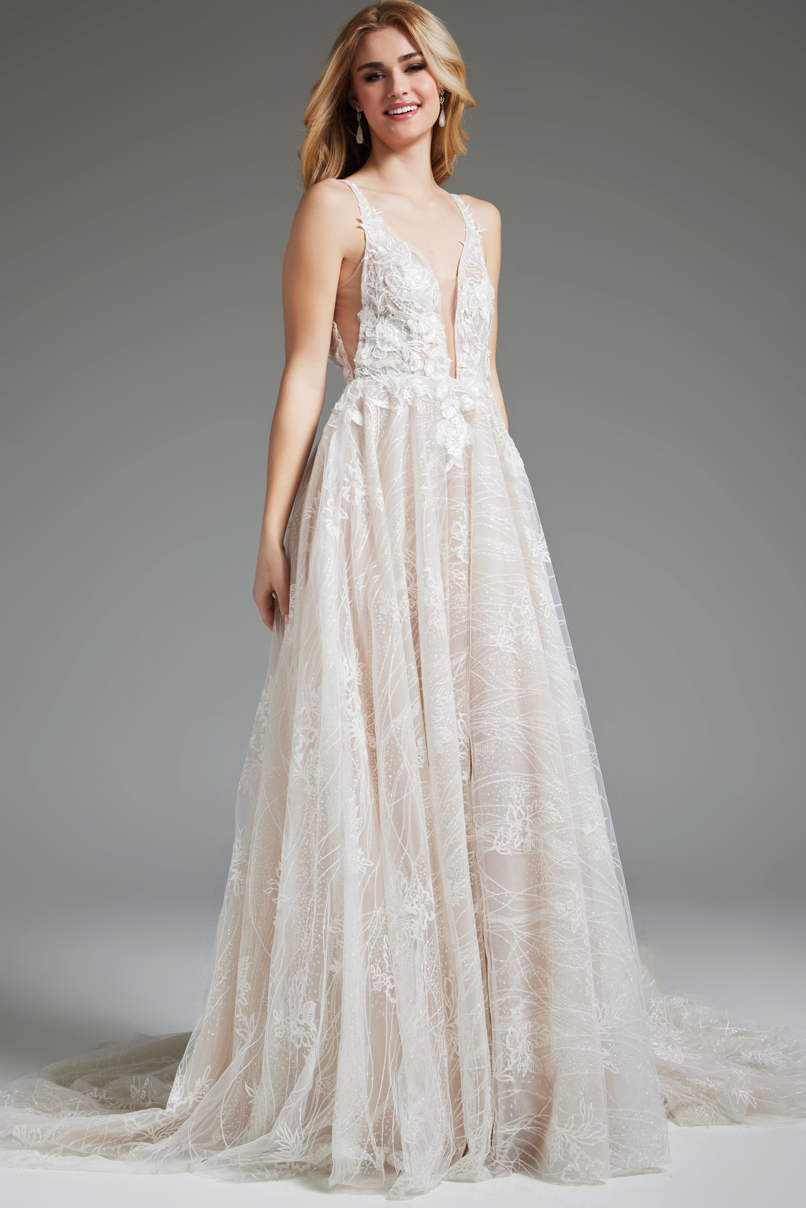 Model wearing Jovani 39435, close-up of gown's intricate lace and deep V-neckline.