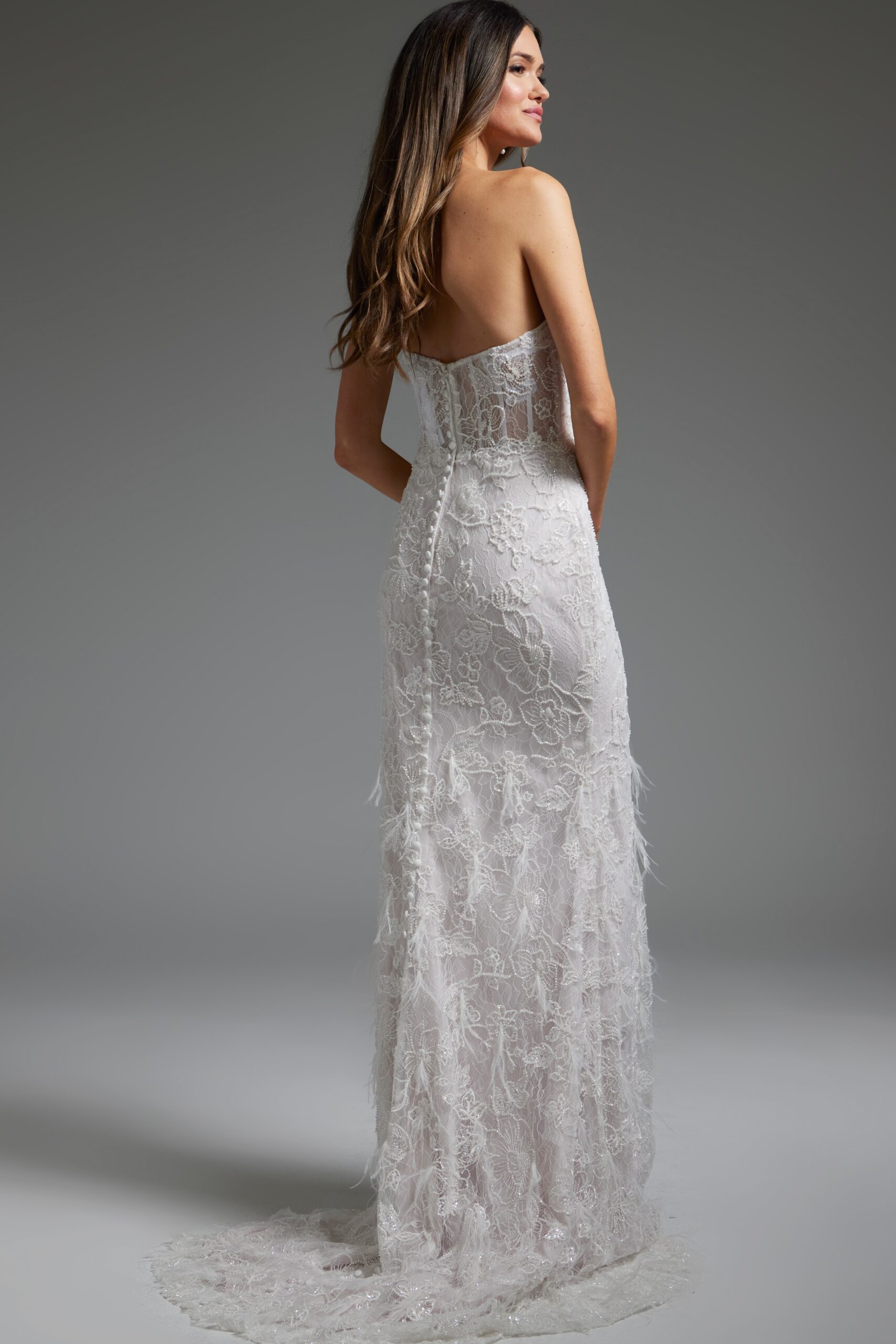 model wearing Jovani JB40590 back view white lace gown with low scoop
