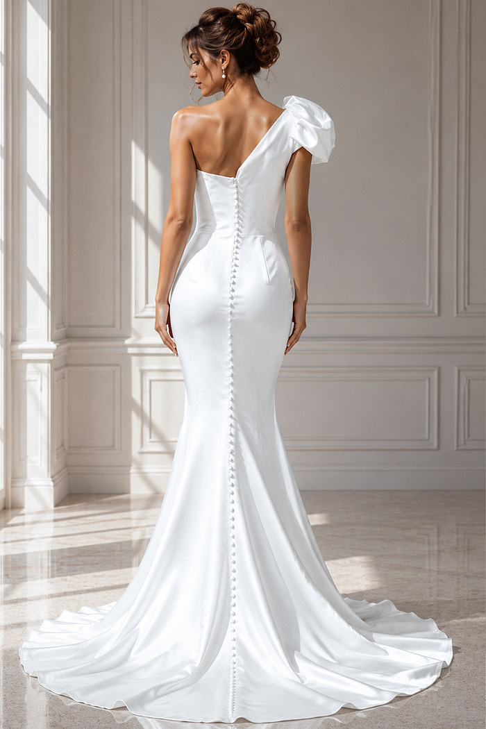 Sophisticated bridal gown crafted in smooth ivory satin, showcasing a puffed shoulder accent