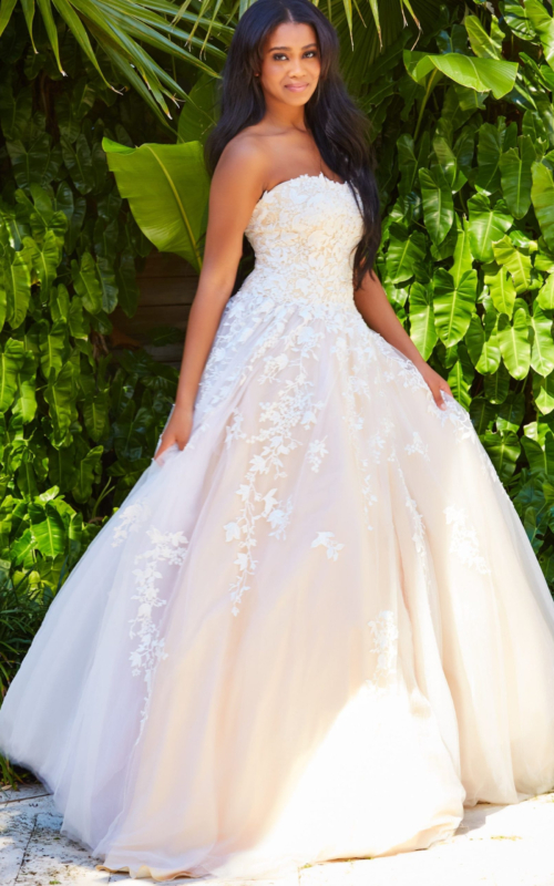 Model wearing Jovani 1831 ball gown in white, front view