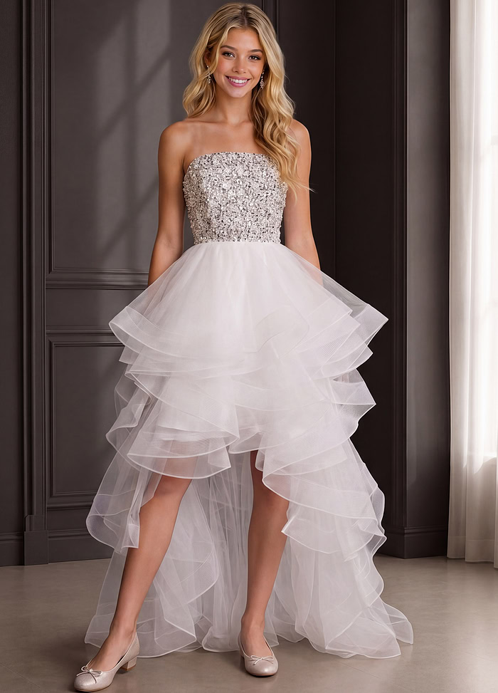 white strapless high low party dress with silver beaded bodice and layered tulle skirt