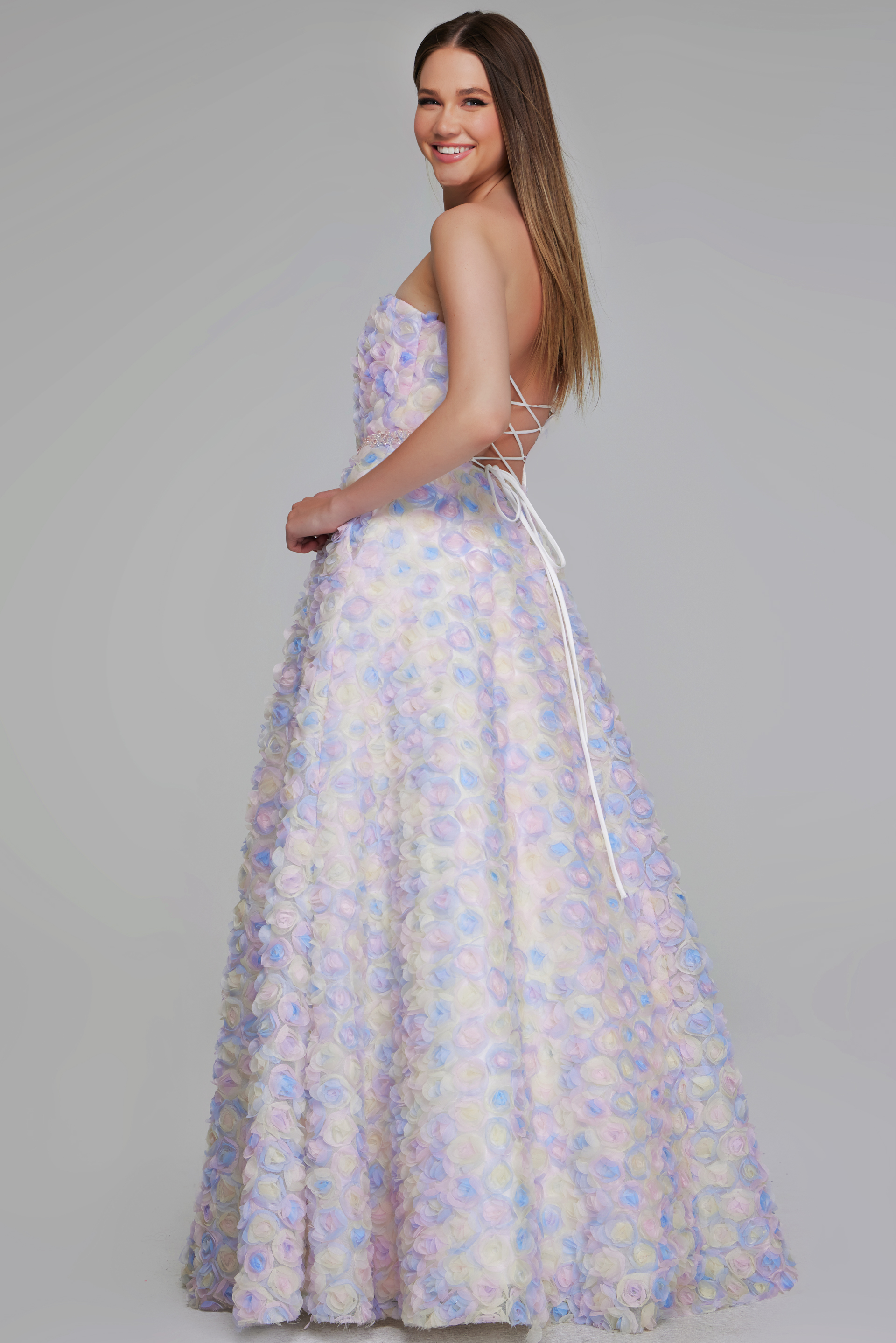 Model wearing K05939 multi-colored gown with lace-up back, side view