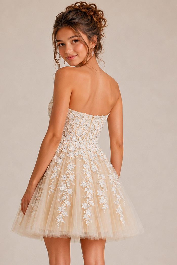 back view of ivory floral lace fit and flare dress with corset back and tulle skirt