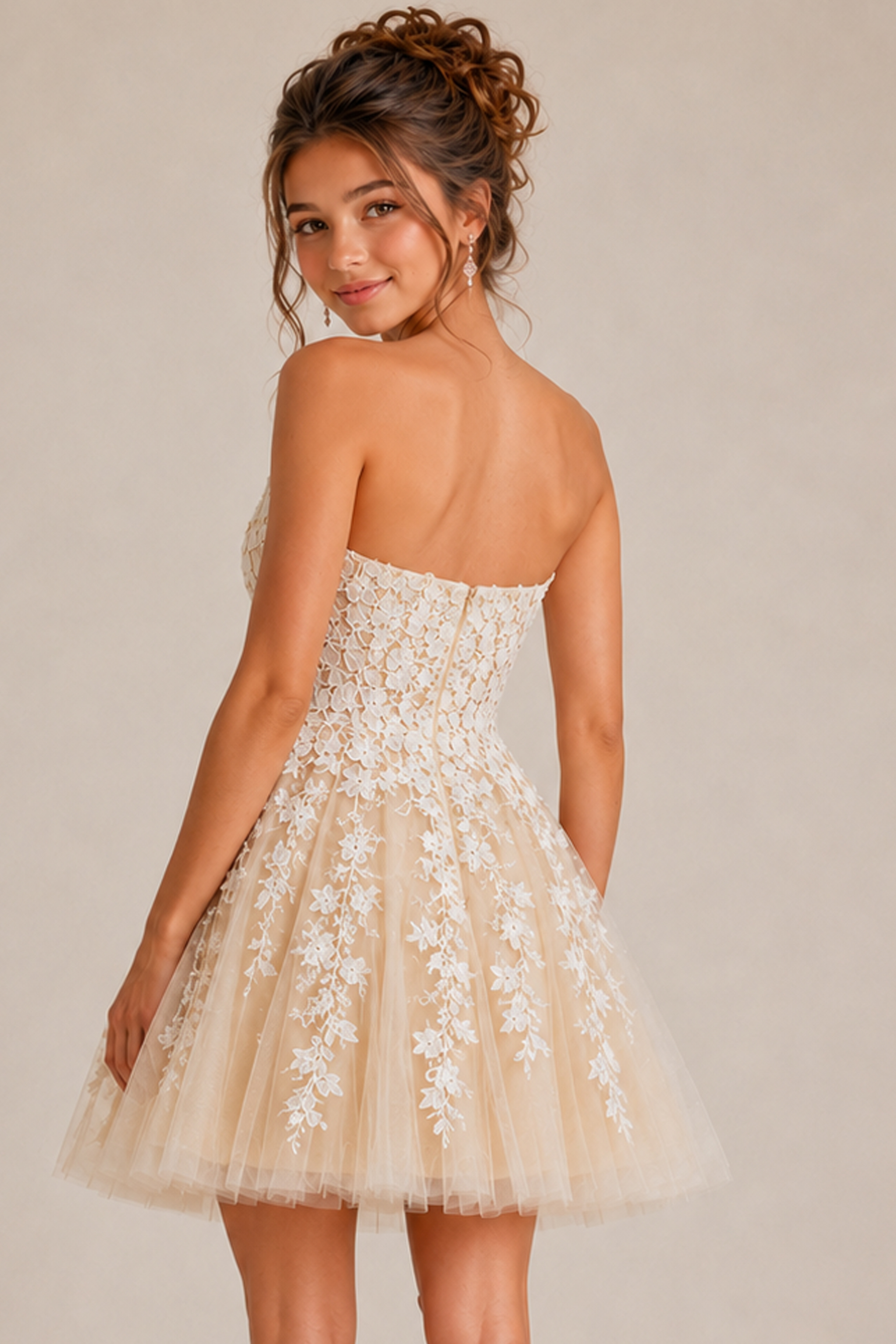 back view of ivory floral lace fit and flare dress with corset back and tulle skirt
