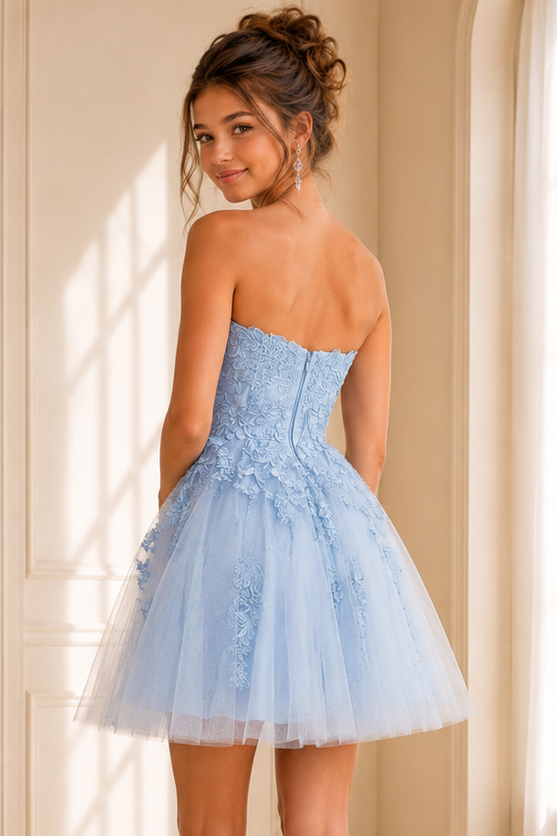 back view of light blue floral lace dress with tulle skirt and zip back