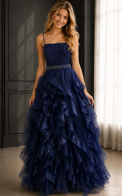 Navy ball gown with lace bodice, spaghetti straps, ruffled tulle skirt, and jeweled waist.