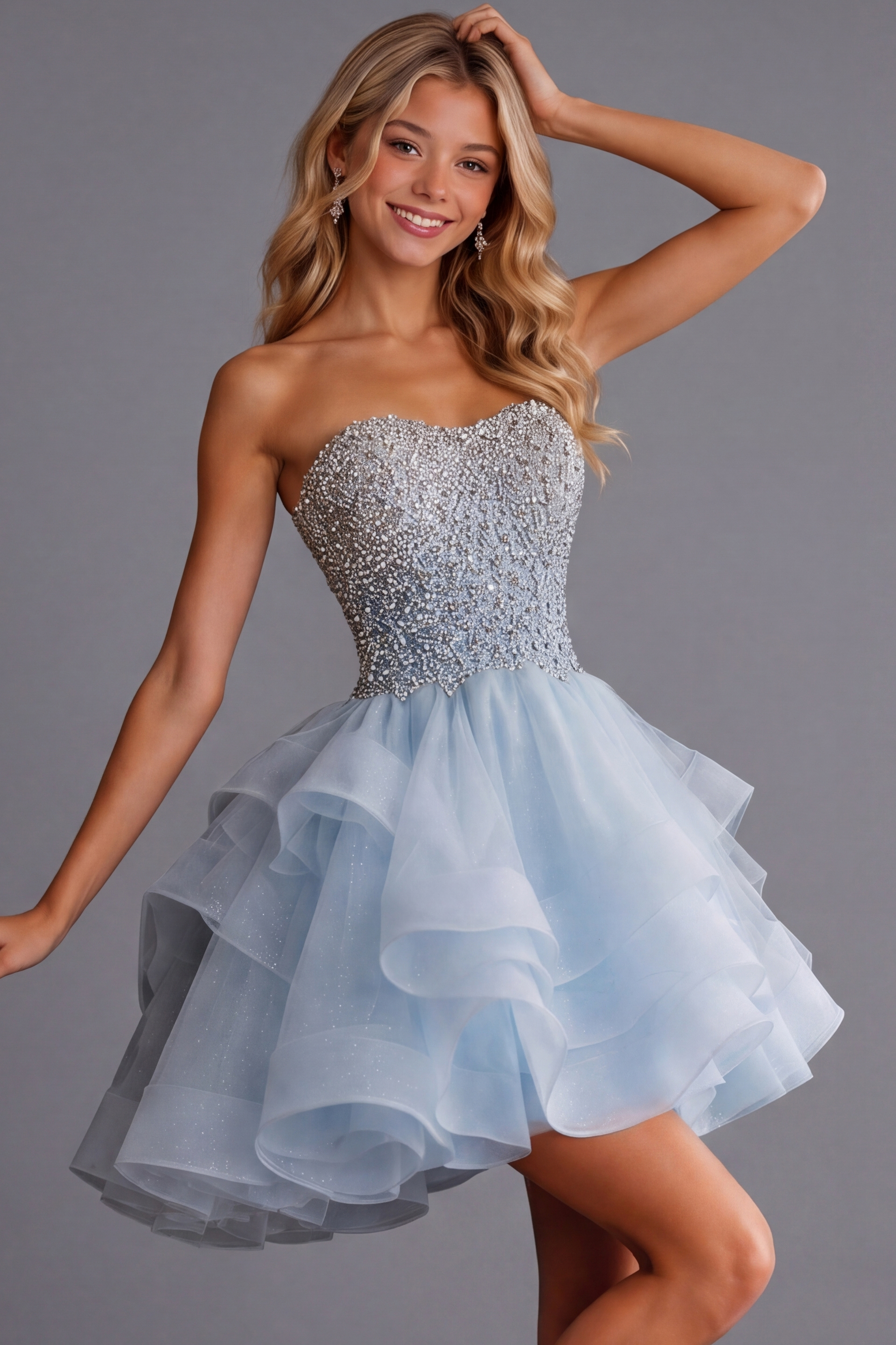 Strapless cocktail dress in icy blue with glittering bodice and flared skirt.