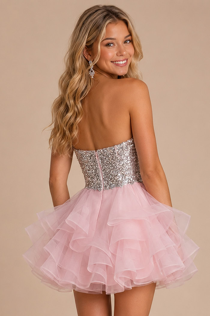 back view of pink dress with sequin bodice and ruffle organza skirt