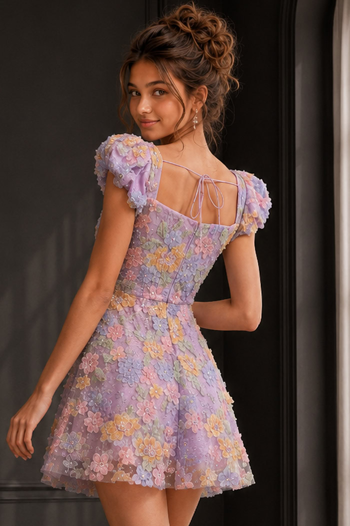 back view of lilac floral applique dress with puff sleeves and tie back