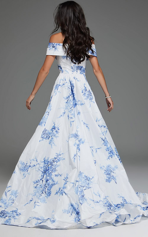 Model wearing Jovani S38939 front view of white and blue off-the-shoulder dress with floral patterns.